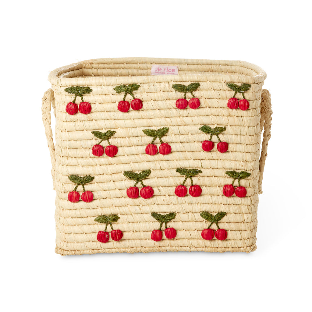 Rice korg i natur med små körsbärsbroderier