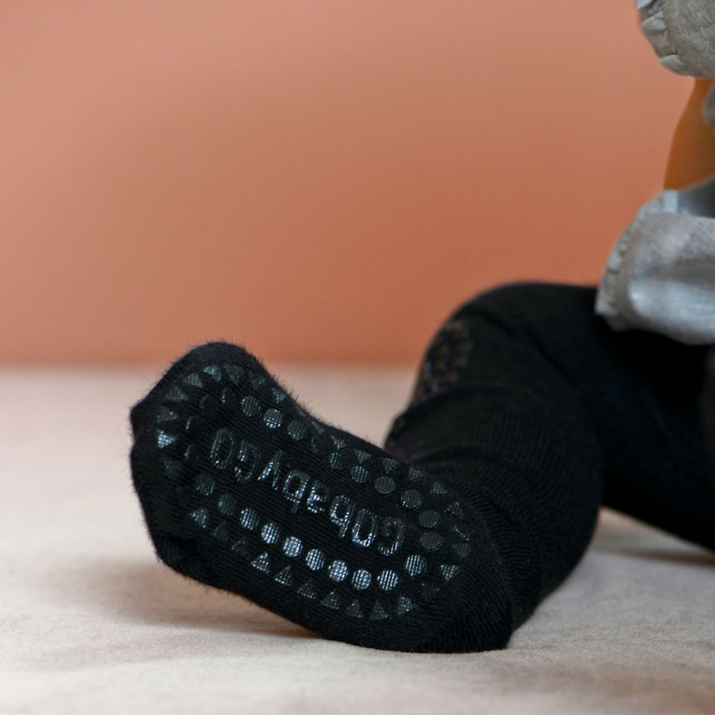 GoBabyGo kravlingsstrumpbyxa med gummiduttar, svart