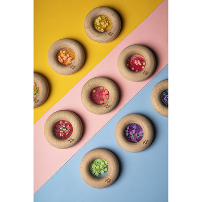 Petit Boum babyleksak, sensorisk donut skallra - Watermelons