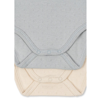 Fanga Fontana Perla bodystocking med långa ärmar, 2-pack – Buttercream/Pearl blue – stl. 0–9 mån.