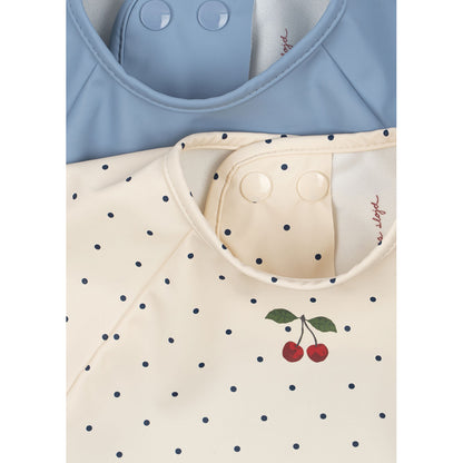 Konges Sløjd Dinner haklapp med ärmar, 6 mån.–3 år – Navy dot/Rain Washed